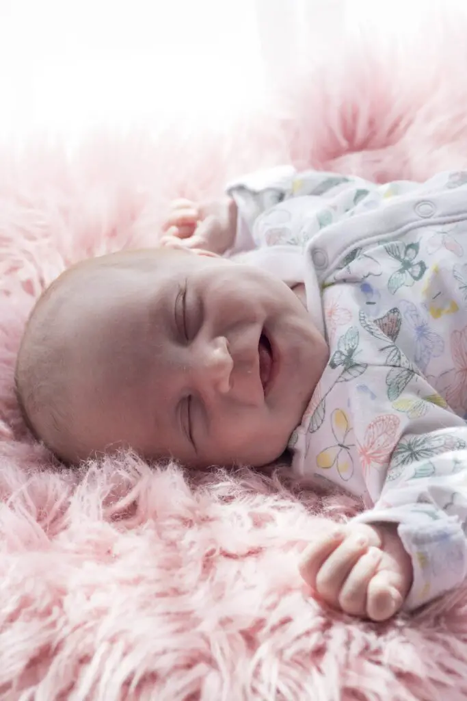 why do babies smile in their sleep