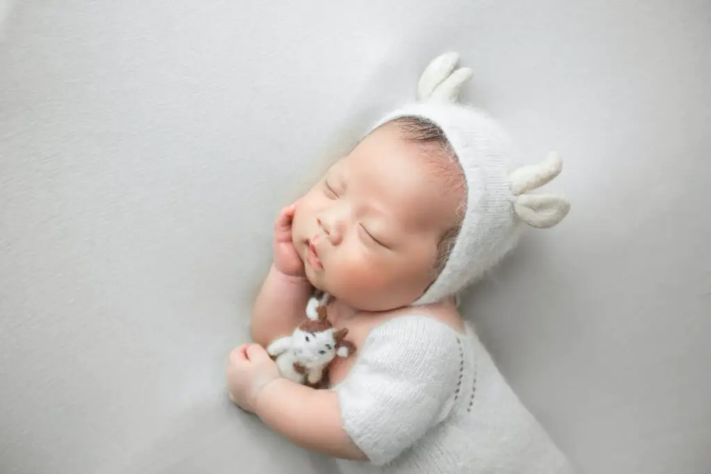 when can a baby sleep with a stuffed animal